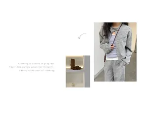 Detailed display of women's minimalist grey marl short zip-up sweatshirt cardigan set.