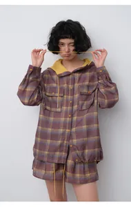 Asian model posing in a purple plaid tencel ramie hooded shirt with yellow hood