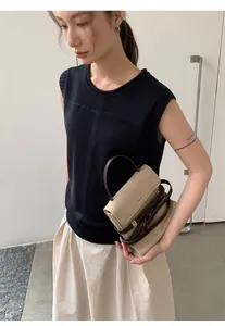 Elegant sleeveless black linen blend knitted top for women shown in lifestyle shot