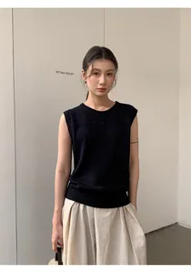 Modern minimalist black sleeveless linen blend knit top for women shown in detail on model