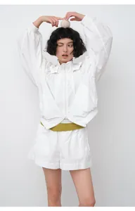 Asian model in white lightweight hooded sun protection jacket with matching shorts set