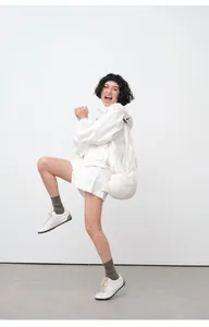 Dynamic full-body shot of a white zip-up hooded sun protection jacket set