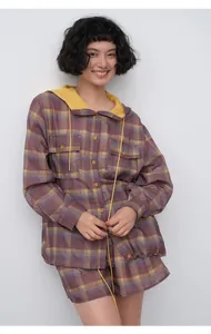 Model wearing a lightweight purple and yellow plaid hooded shirt and shorts set for women.