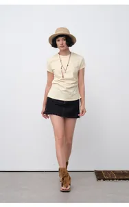 Model wearing Korean style slim fit cream short sleeve T-shirt with waist-cinching pleats