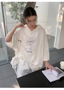 Korean style oversized white hooded sweatshirt with artistic apple graphic and text