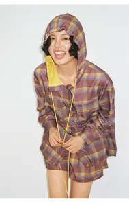 Detail of a lightweight plaid hooded shirt for women with breathable tencel fabric