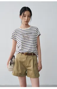Fashionable khaki pleated mid-waist shorts for women featuring casual cuffed hem design.