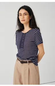 Close-up detail of navy blue striped knit T-shirt with Henley neck and button placket