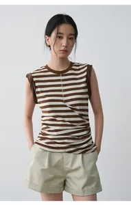 Detailed view of women's khaki mid-waist cuffed casual shorts for summer outfit