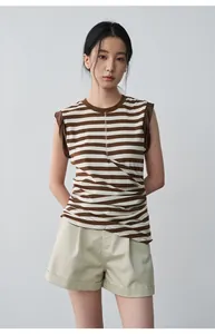 Chic khaki mid-waist pleated shorts with rolled hem for a casual summer look