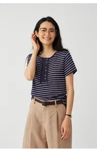 Close-up of a women's navy blue striped knit T-shirt made of Tencel linen blend.