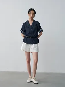 Elegant white pleated mid-waist cuffed shorts for women, perfect for summer casual wear