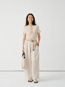 Elegant minimalist women's tencel linen blend short sleeve knit t-shirt in a soft beige color