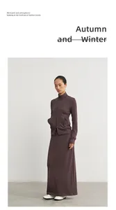 Detail showing modal knit long skirt with matching zip-up jacket in deep brown