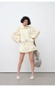 Detailed full-body view of lightweight pale yellow hooded sun protection jacket