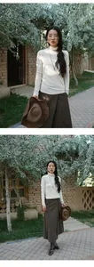 Modelo asiática con cuello alto blanco y falda marrón en un entorno de jardín