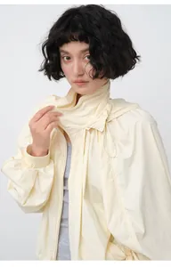 Close-up of lightweight pale yellow hooded sun protection jacket for women summer wear
