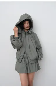 Women's lightweight hooded sun protection jacket with matching shorts set in olive green