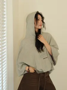 Stylish grey oversized hooded sweatshirt with mesh overlay for women's casual wear