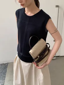 Elegant navy blue sleeveless knit vest with roll neck for women's spring fashion