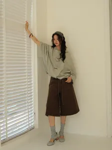 Casual oversized long sleeve sage green hooded sweatshirt in Korean style for women.
