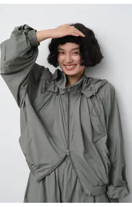Lightweight sage green hooded sun protection jacket with casual loose fit for women.