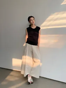 Modern black sleeveless linen-blend knit top for women featuring a chic minimalist design.