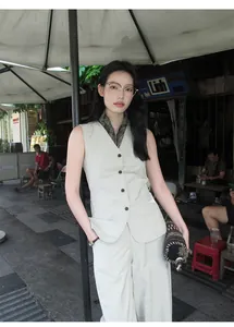 Full body view of a minimalist beige cotton blend V-neck sleeveless vest and pants