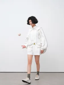 Loose-fit white lightweight hooded sun-protection jacket for women, perfect for summer.