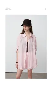 Detailed view of a light pink Tencel ramie oversized shirt, perfect for summer sun protection