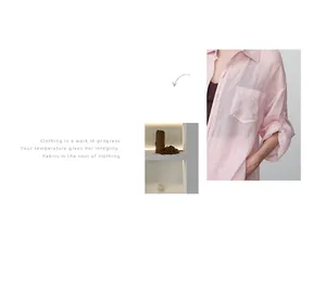 Detailed macro view of light pink Tencel ramie relaxed fit blouse with soft fabric texture