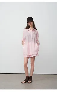 Loose-fit pink tencel ramie shirt and matching shorts for a stylish, casual summer look.