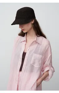 Detail view of women's pink tencel ramie lazy style shirt with breast pocket for summer.