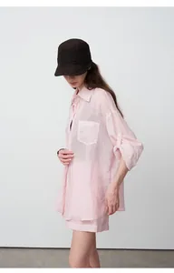 Side view of a pink Tencel ramie oversized shirt for summer sun protection outfit