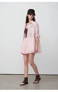 Professional model wearing a pink tencel ramie oversized shirt with matching shorts set