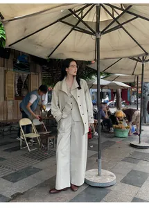 Minimalist beige V-neck sleeveless waistcoat set with matching wide-leg trousers