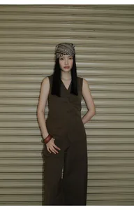 Minimalist dark brown V-neck sleeveless vest with matching pants and headscarf styling