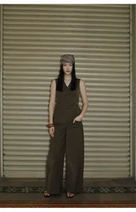 Full view of a dark brown minimalist cotton-nylon blend V-neck vest and wide-leg pants set.