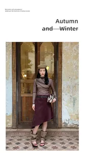 Vintage burgundy asymmetrical A-line skirt styled with a brown top and beret for autumn fashion