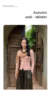 Fashionable pink knitted cardigan and gradient scarf set on model in garden setting