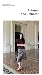 Elegant satin skirt with irregular lace hem in a classical architectural setting