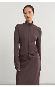 Asian model wearing a brown modal knit jacket and matching straight midi skirt