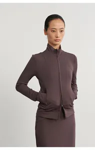 Close-up of mauve modal knit athletic zip-up jacket and matching midi skirt.