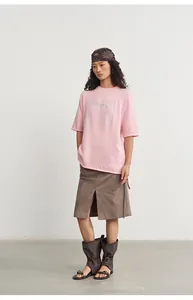 Detail view of pink loose knit top with silver thread jacquard and half sleeves