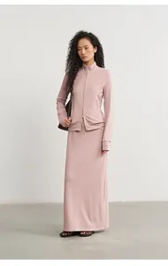 Full body view of the pink modal knitted skirt and jacket set on an Asian model.