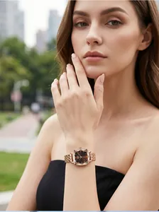 Close-up of GEDI women's rose gold square watch with faceted crystal on model wrist