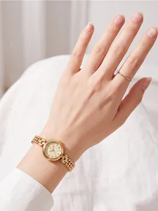 Elegant gold retro quartz watch for women with multi-row bead chain shown on wrist