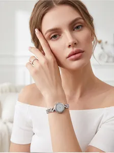 Close-up view of an elegant women's silver quartz watch with multi-row bead chain strap