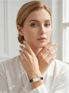 Close-up of elegant French vintage double dial rectangular watch on woman's wrist