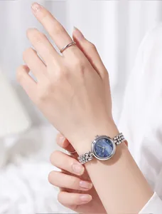 Detail shot of Gedi vintage silver women's watch with blue dial and bead bracelet